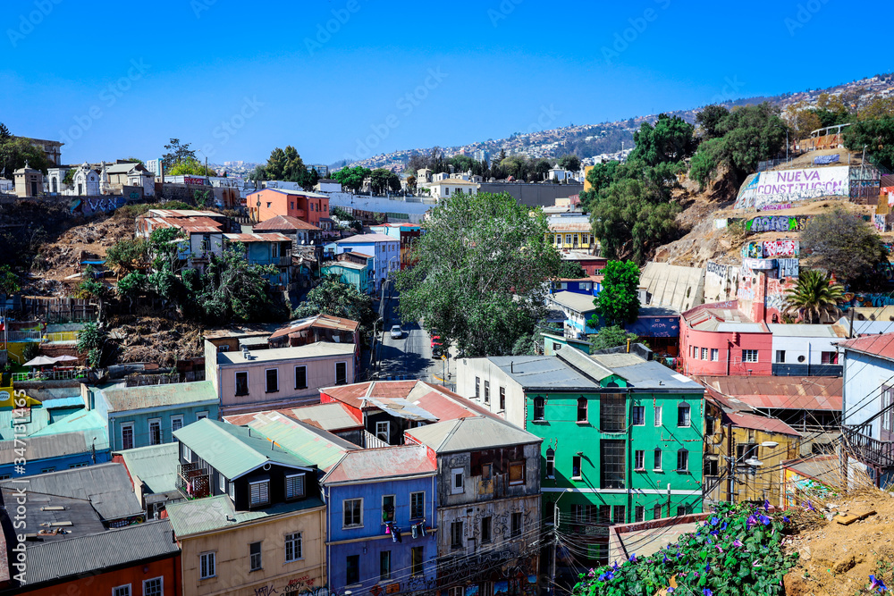 Valparaiso, Chile - March 08, 2020: Daily Life View to the Multi Colored Buildings with Bright Painting on the Streets