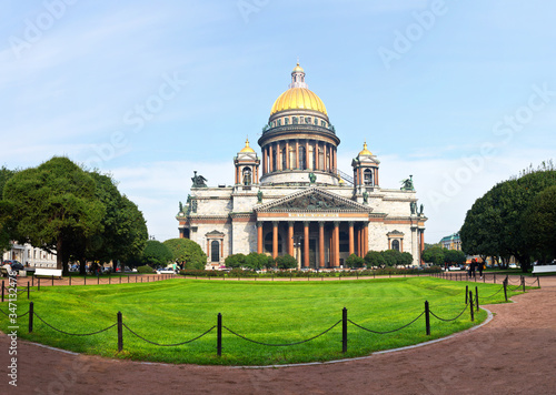 St. Petersburg at summer. Panoramic view of the facade of Saint Isaac's Cathedral or Isaakievskiy Sobor (architect Auguste de Montferrand) from the Park of St. Isaac's Square with green lawn