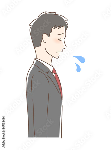 悲しむ男性の横顔