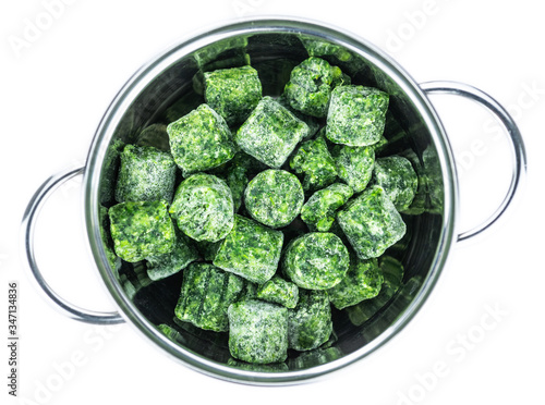 Portion of frozen spinach isolated on white