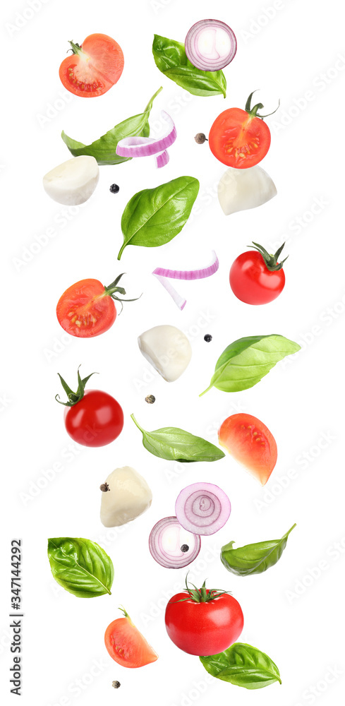 Mozzarella cheese, tomatoes, onion and basil leaves falling on white background Mozzarella cheese, tomatoes, onion and basil leaves falling on white background
