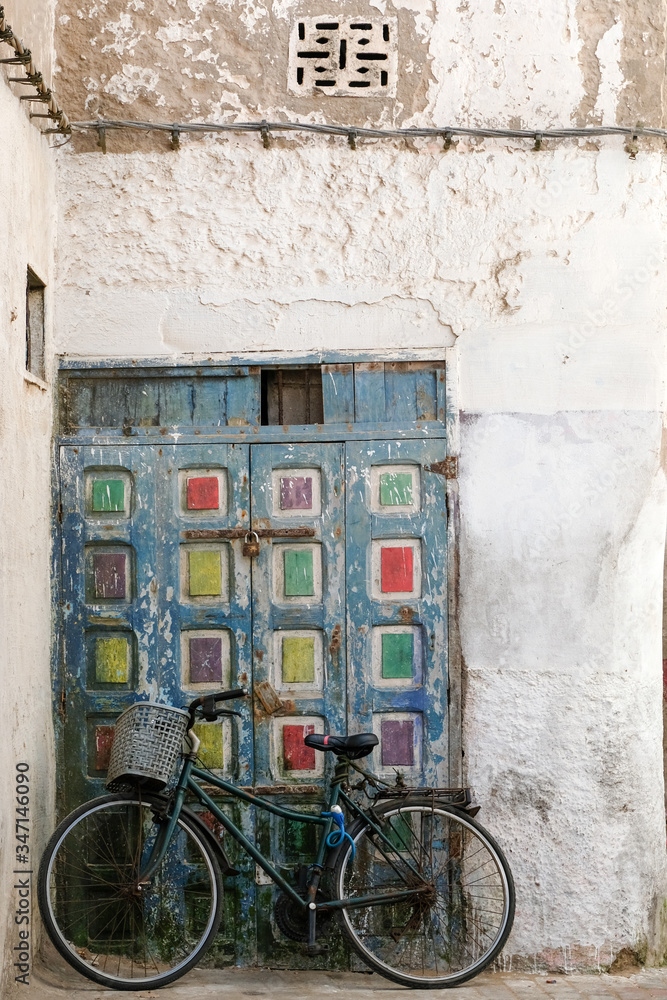 Bicycle and old house facade in Essaouira, Morocco.