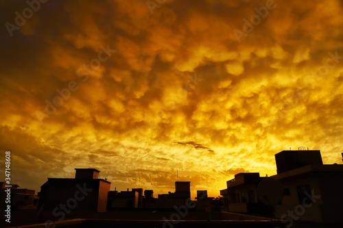 beauiful view of yellow clouds during sunset in india