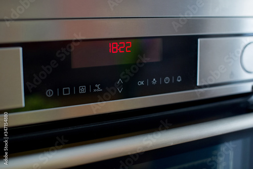 Oven control panel in the kitchen.