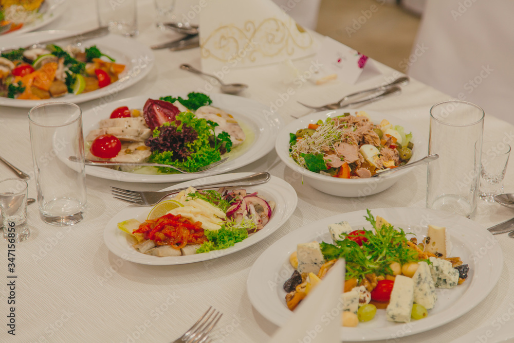 Salads on the festive table at the wedding Salads on the festive table at the wedding