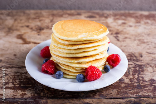 Stack of homemade pancakes berries. Typical American breakfast or snack. photo