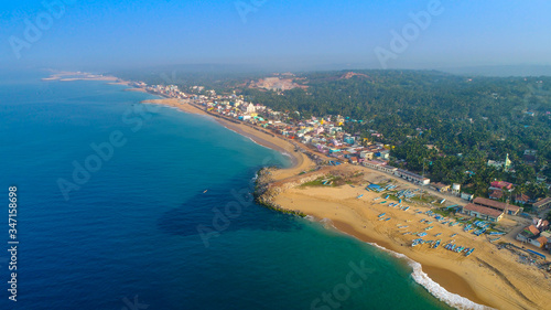 Top view of beautiful white sand beach with turquoise sea water and palm trees, aerial drone shot © edwinvijayakumar