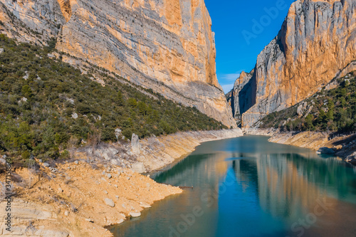 A picturesque landscape view of the valley with the canyon and the turquoise water of the Canelles river in the natural park of Congost de Mont-rebei (Spain)