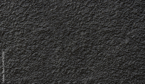 New asphalt close-up. Black background or texture.