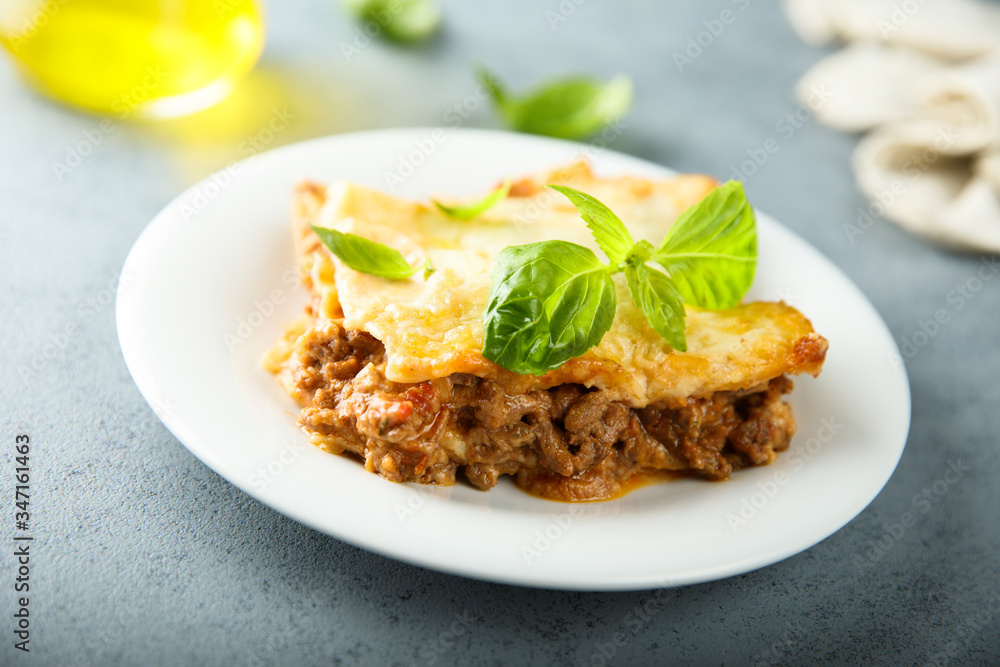 Traditional homemade lasagna with fresh basil Traditional homemade lasagna with fresh basil