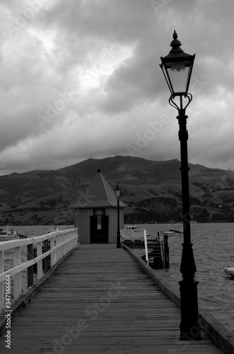 Wooden pier at Akaroa Harbour, Canterbury. Black and white © Sofia ZA