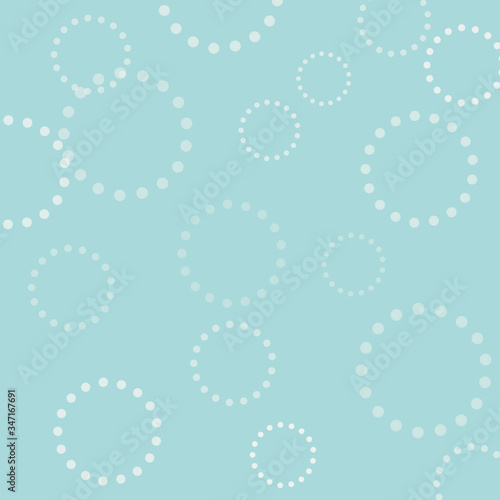 Blue background with a white pattern, delicate texture, sky color, light abstract, blurred background, fuzzy pattern, white spots on a blue background, circles made of dots, white circles