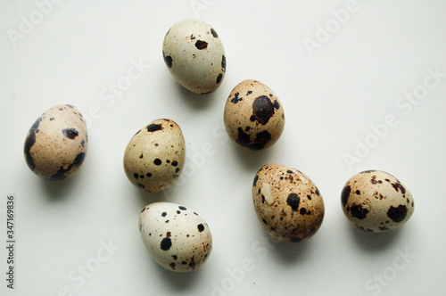 Quail eggs pattern. Big collection of quail eggs on white background. Easter concept. Flat lay, top view, copy space