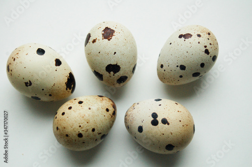 Quail eggs lie randomly. Photo taken close