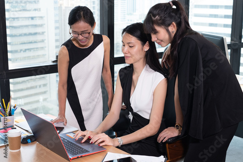 businesswoman team standing brainstorming together near window