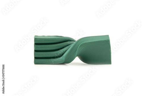 Piece of green plasticine isolated on a white background
