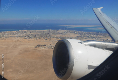  Airplane aircraft takeoff at Hurghada International Airport Egypt. View from the charter tourist airliner