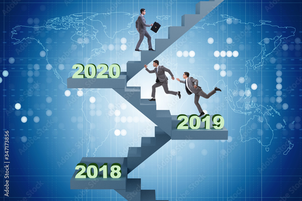 Businessman climbing stairs on yearly basis Businessman climbing stairs on yearly basis