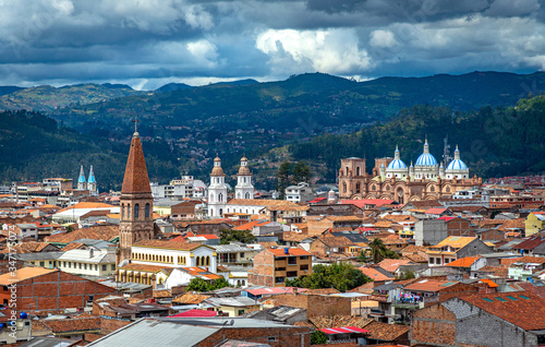 View of the city of Cuenca, with it's many churches, cathedrals and houses, in the middle of the Ecuadorian Andes, on a sunny afternoon, Ecuador, South America.