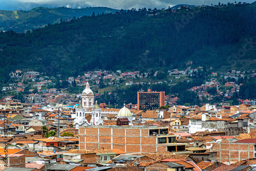 View of the city of Cuenca, with it's many churches, cathedrals and houses, in the middle of the Ecuadorian Andes, on a sunny afternoon, Ecuador, South America.