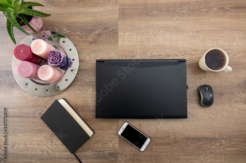 Young female business working on computer, sitting at the table