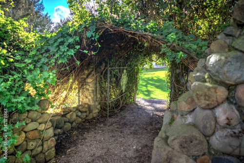 Small tunnel covered with plants and vegetation  made with stones  at the Pumapungo Archeological museum  Cuenca Ecuador.