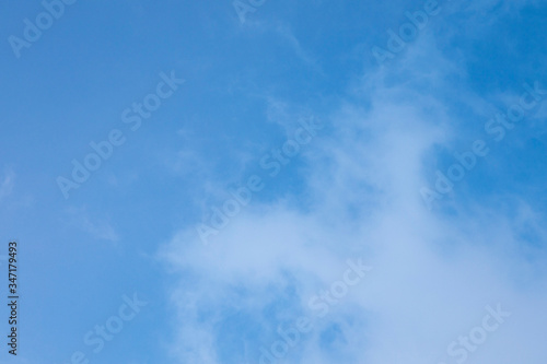 Beautiful white Cirrus clouds in a blue sky. Background and texture of the sky