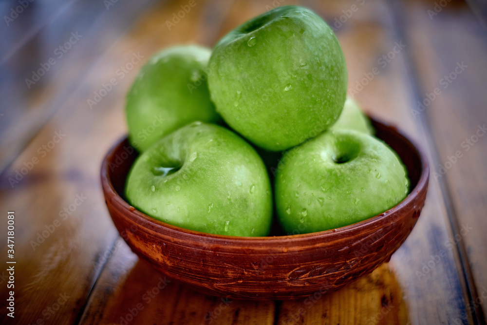 green apples on the table after rain green apples on the table after rain