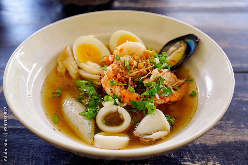 Spicy lemongrass flavored flat noodles with seafood Spicy lemongrass flavored flat noodles with seafood