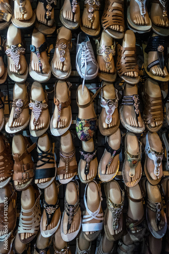Collection of flipflops with mannequin doll feet