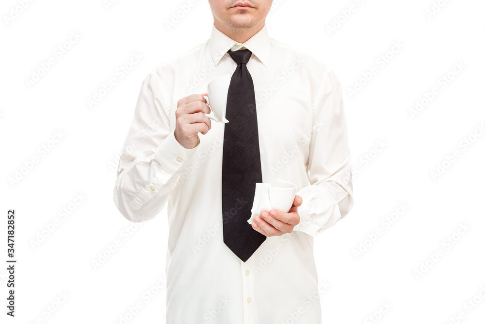 faceless businessman in shirt with tie calmly holds broken cup and drink coffee collapse symbol, mock up concept of crisis and financial system crash isolated on white with a copy space. faceless businessman in shirt with tie calmly holds broken cup and drink coffee collapse symbol, mock up concept of crisis and financial system crash isolated on white with a copy space.
