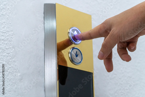 Hand push the elevator button up