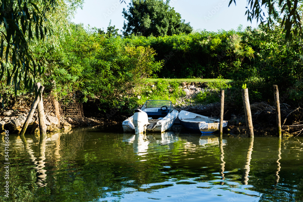 Boats at shoreline in Danube Delta, Romania Boats at shoreline in Danube Delta, Romania