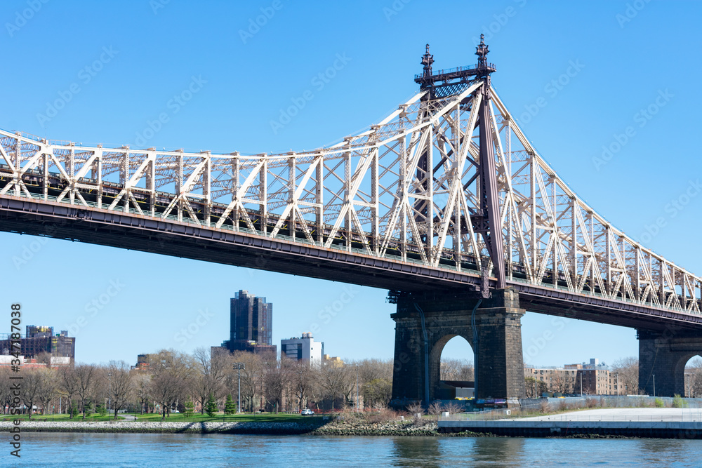 The Queensboro Bridge over the East River with a view of Long Island City Queens New York