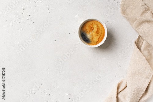 Cup of coffee espresso on white background with tablecloth, minimal