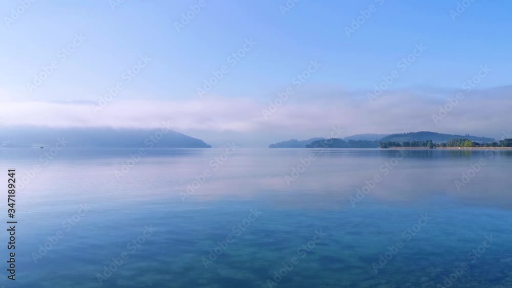 green park and blue lake near a lake in Switzerland. Perfect location for Yoga lifestyle green park and blue lake near a lake in Switzerland. Perfect location for Yoga lifestyle