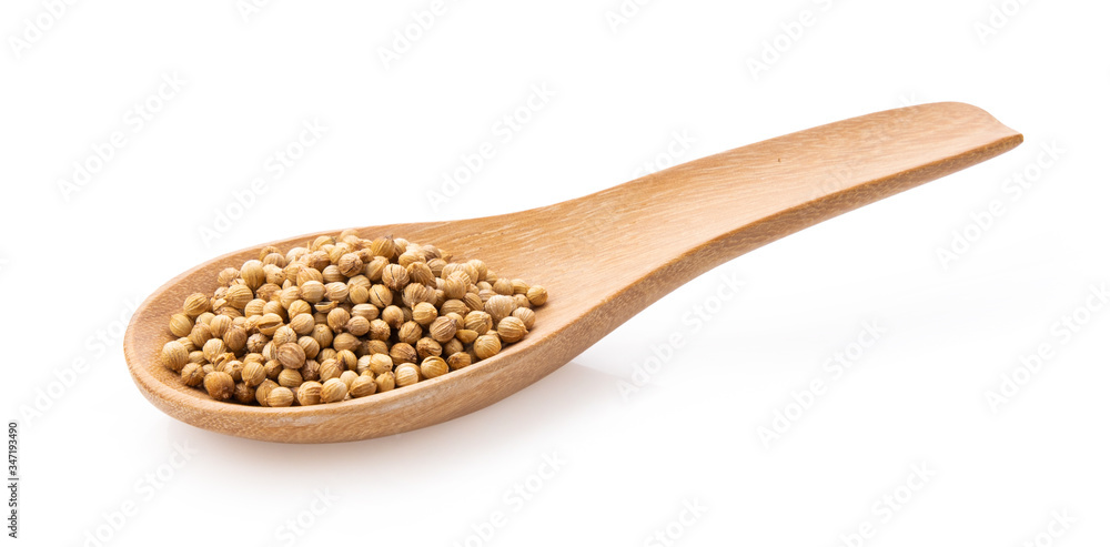 Coriander seeds in wood spoon on white background Coriander seeds in wood spoon on white background