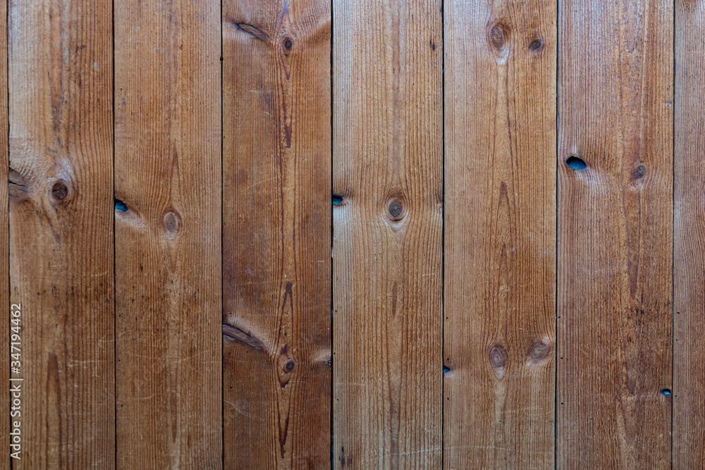 Old wood plank texture background. Close up of wall made of wooden planks. Old brown wooden wall background texture close up. Soft wood surface as background