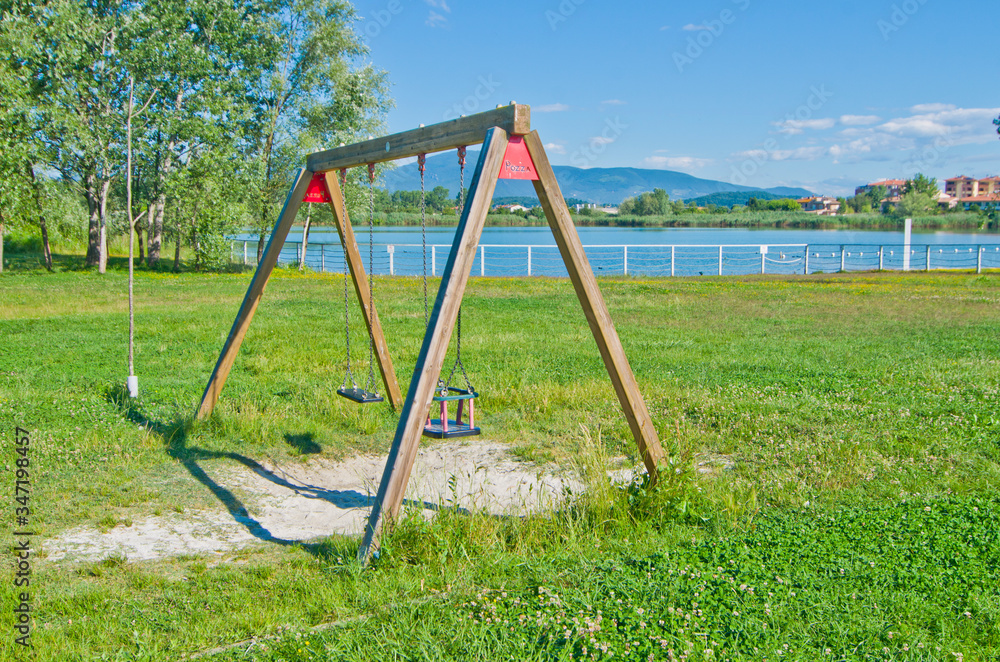 blue lake near the city with games for children blue lake near the city with games for children
