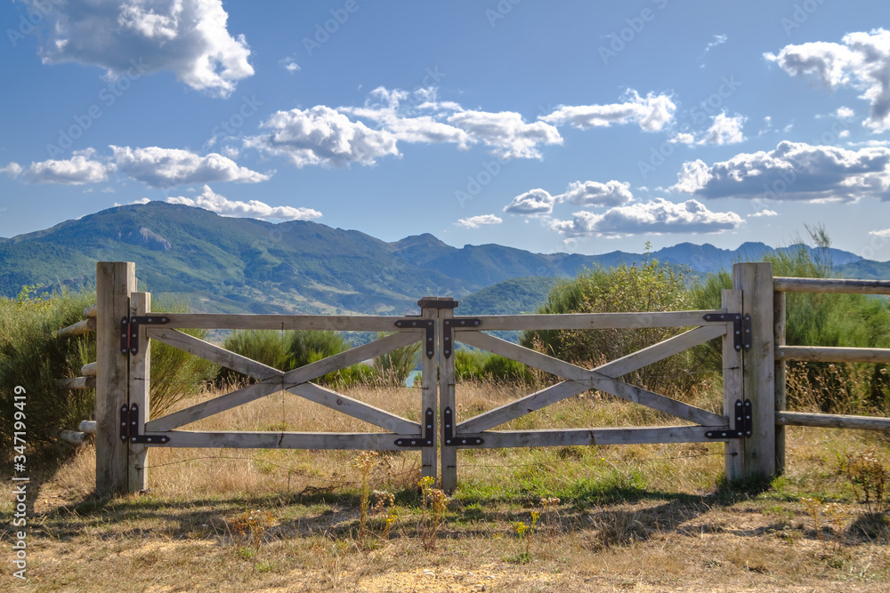 Open gate in a field in Argentina, tranquera to prevent the movement of farm animals