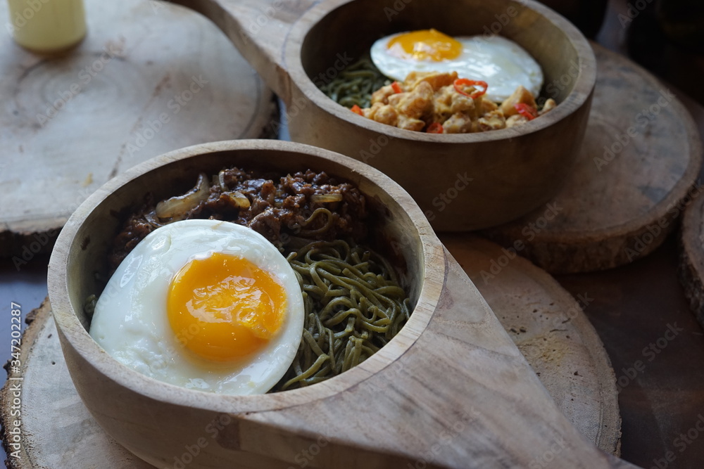 Green Noodle in a Wooden Bowl Green Noodle in a Wooden Bowl