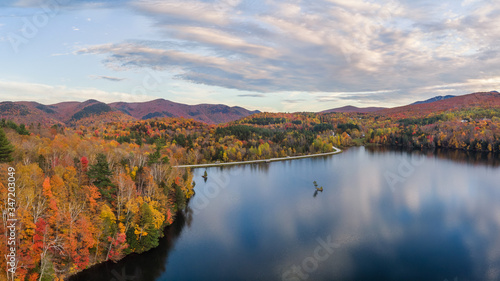 Fototapeta Naklejka Na Ścianę i Meble -  Autumn Sunset in Killington Vermont at Kent Pond - Gifford Woods State Park