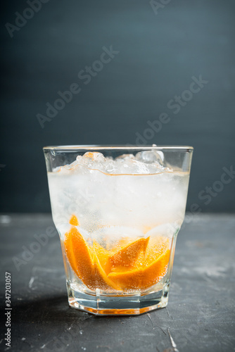 Wallpaper Mural Old fashioned beverage with orange slices on rustic background. Selective focus. Shallow depth of field. Torontodigital.ca
