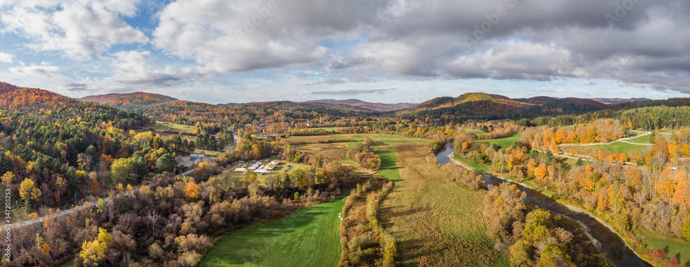 Autumn view of Woodstock Vermont area farms and  Ottauquechee River 