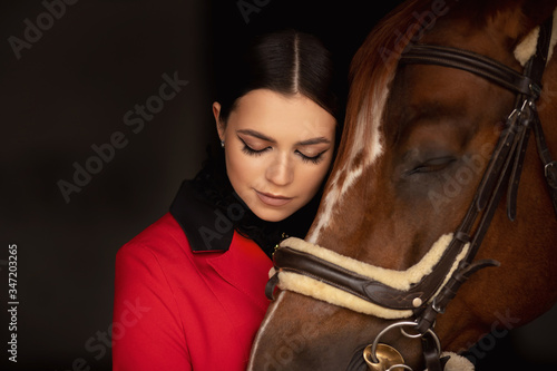 Sensual photo young woman rider and horse, concept of mutual understanding of girl and animal, antistress therapy