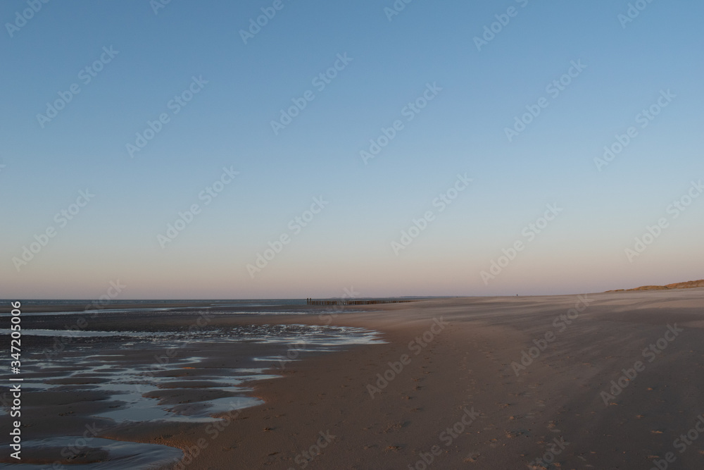 Sand dunes near to the sea sundowner