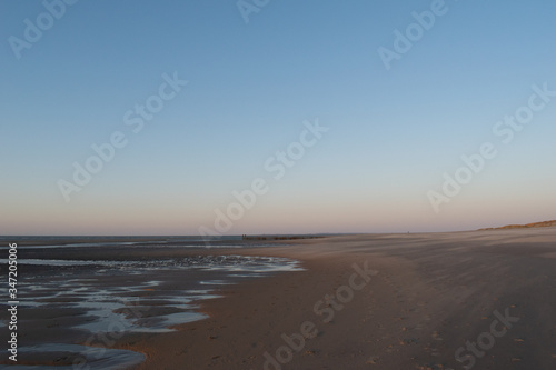 Sand dunes near to the sea sundowner © Marie