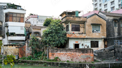 Shunde, Foshan, China - April 3, 2017: old house in the small old town city in China, Asia, colonial architecture, British architecture, rich Easter Chinese culture, public streets, poverty in Asia 