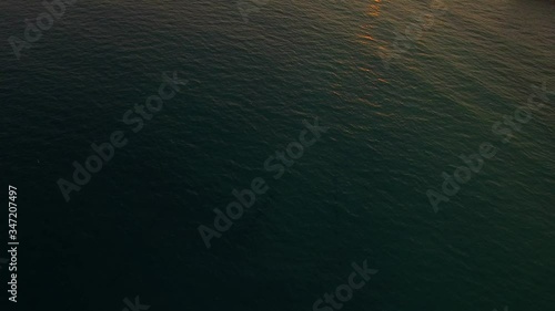 Aerial of people swimming at Tran Phu beach Nha Trang, Vietnam. A beautiful seaside promenade with plenty of luxury and mid-range beachfront resorts, souvenir shops, museums,seafood restaurants photo