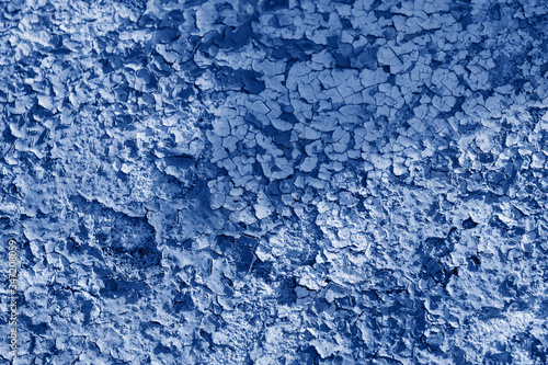 Blue background of a peeling wall. The fashion trend of the year is classic blue. Abstract texture, Wallpaper.